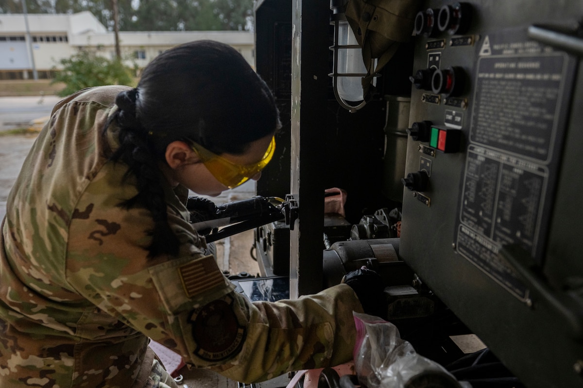 A U.S. Airman wipes down equipment