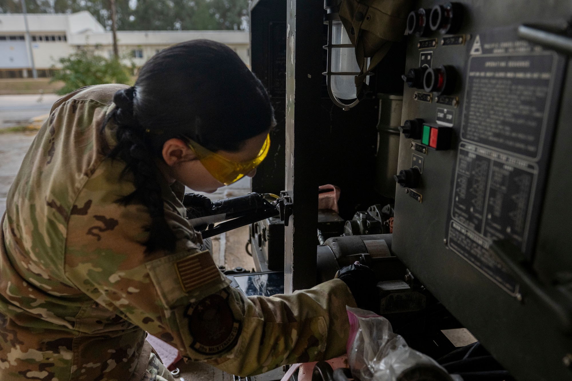 A U.S. Airman wipes down equipment