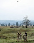 Capt. Ryan Hafley, commander, Headquarters and Headquarters Company, 96th Troop Command, attaches a new target to a unmanned aerial system during the FIFA Field-Ready Range Day at Joint Base Lewis-McChord, Wash., Feb. 11, 2026. Photo by Joseph Siemandel.