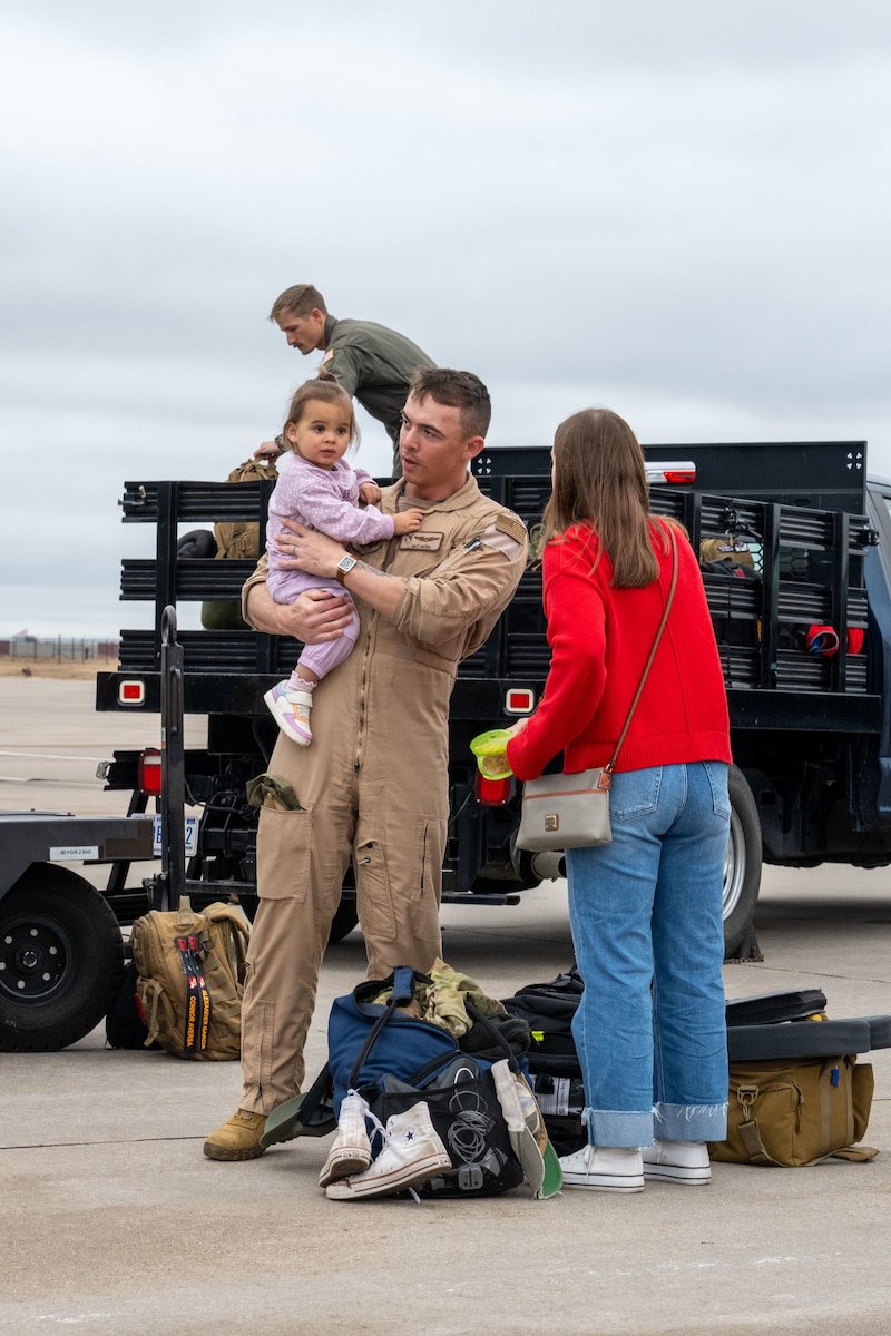 Airmen reunite with family and friends at McConnell Air Force Base, Kansas, Feb. 14, 2026. Team members deployed in support of ongoing operations, providing global reach and rapid air refueling capabilities. (U.S. Air Force photo by Senior Airman Paula Arce)