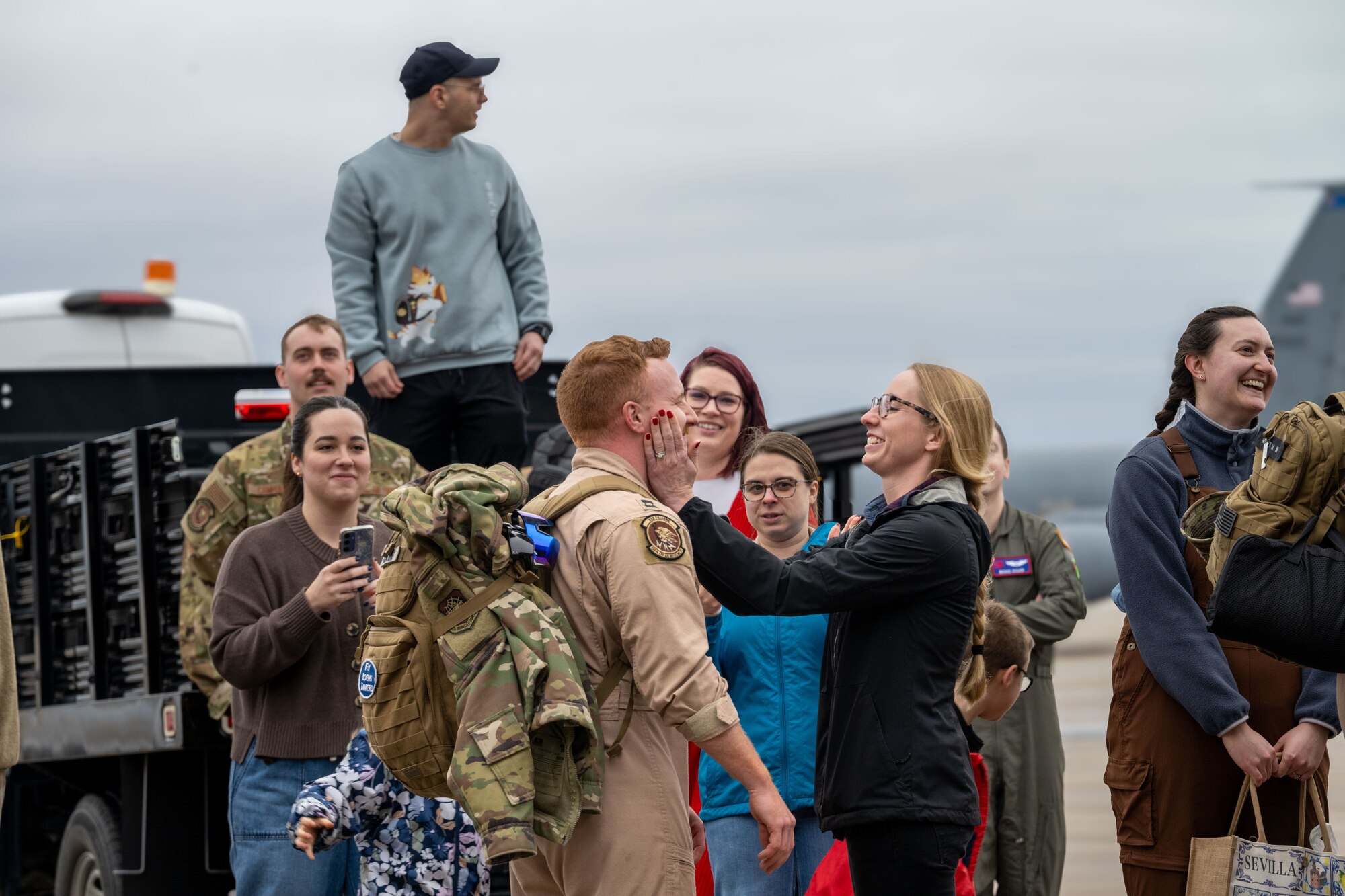 Airmen reunite with family and friends at McConnell Air Force Base, Kansas, Feb. 14, 2026. Team members deployed in support of ongoing operations, providing global reach and rapid air refueling capabilities. (U.S. Air Force photo by Senior Airman Paula Arce)
