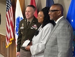DLA Troop Support Commander Army Brig. Gen Sean P. Kelly stands next to Cynthia Mitchell-Riley, joined by her husband Reginald, during her retirement ceremony from Troop Support in Philadelphia on Feb. 12.