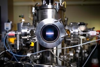 A rope of argon plasma extends between two magnetrons at the U.S. Naval Research Laboratory (NRL) in Washington, D.C., Feb. 2, 2026. NRL scientists use this magnetron sputter system to synthesize epitaxial thin films for new materials discovery. (U.S. Navy photo by Sarah Peterson)