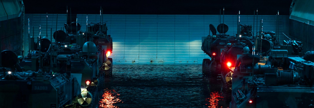 U.S. Marines with 3rd Assault Amphibian Battalion, 1st Marine Division, stage Amphibious Combat Vehicles on the well deck of Wasp-class amphibious assault ship USS Makin Island (LHD 8) during Quarterly Underway Amphibious Readiness Training 26.2, off the coast of California, Jan. 25, 2026. QUART enhances the warfighting proficiency of the Navy-Marine Corps team. This routine training forges a more integrated and lethal force, ensuring our Marines and Sailors are prepared to respond to crisis and win in conflict. (U.S. Marine Corps photo by Cpl. Mary R. Jenni)