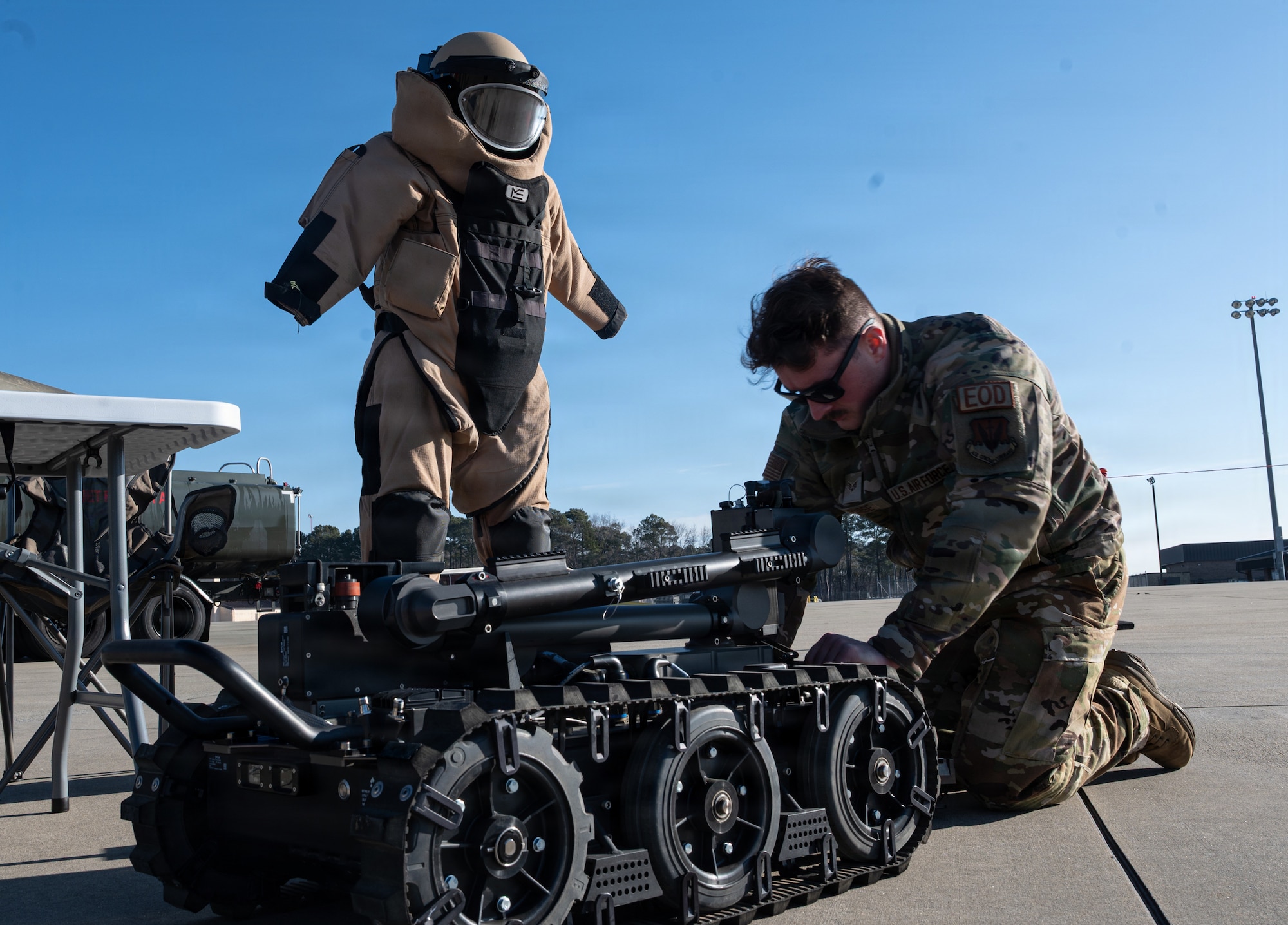 U.S. Air Force Senior Airman Tyler Purse, 4th Civil Engineer Squadron explosive ordnance disposal technician, showcases an explosive recovery device during a Airpower Generation Rally at Seymour Johnson Air Force Base, North Carolina, Feb. 6, 2026. The event allowed family members to interact with various Air Force mission specialties and gain insight into airpower generation. (U.S. Air Force photo by Airman 1st Class Holly Leonard)