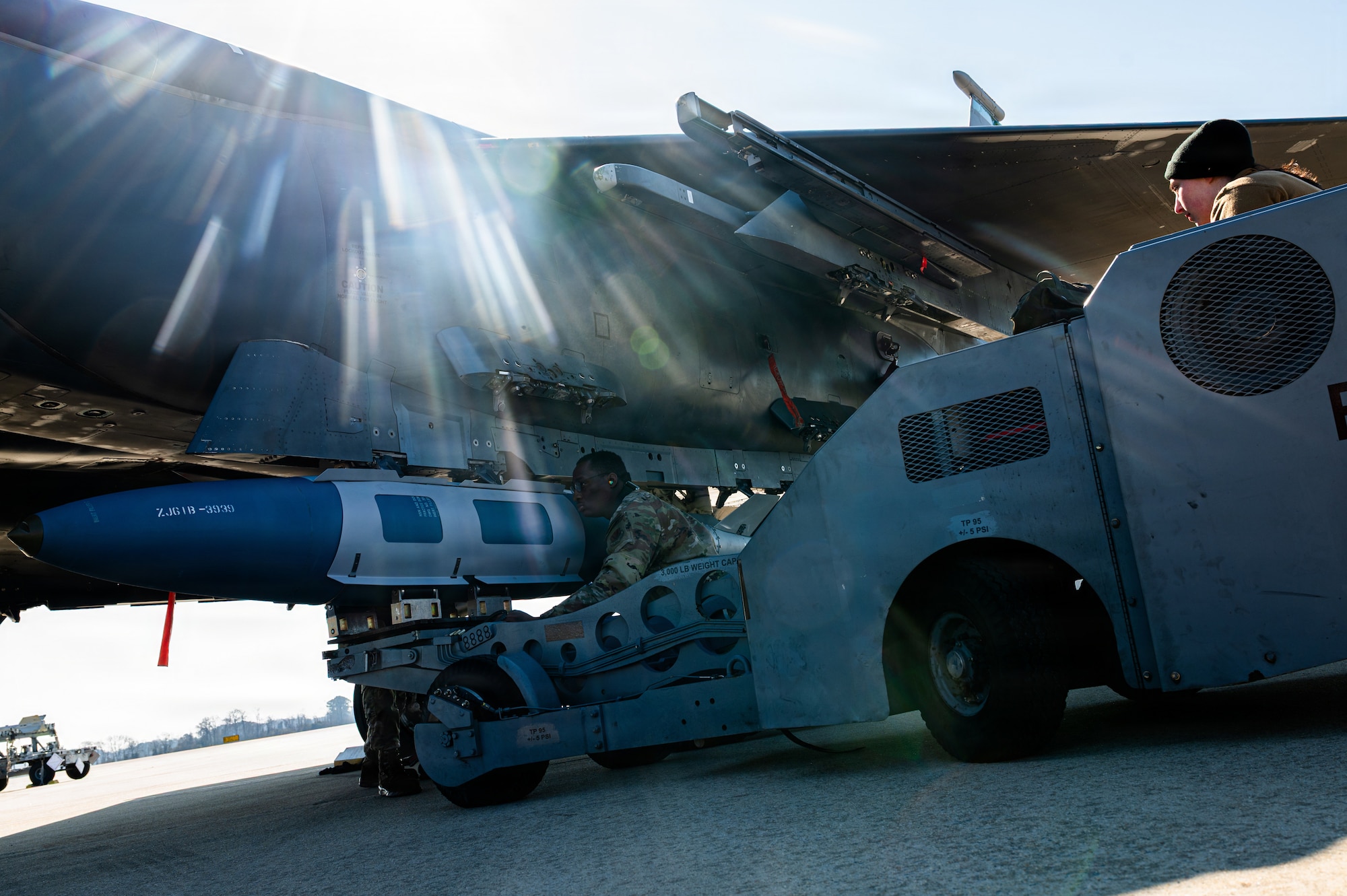 U.S. Air Force Staff Sgt. Tymalik Garrison, 335th Fighter Generation Squadron weapons quality assurance inspector, loads explosives onto an F-15E Strike Eagle during a Airpower Generation Rally at Seymour Johnson Air Force Base, North Carolina, Feb. 6, 2026. The rally challenged maintainers to refine their skills in support of rapid aircraft generation. (U.S. Air Force photo by Airman 1st Class Holly Leonard)