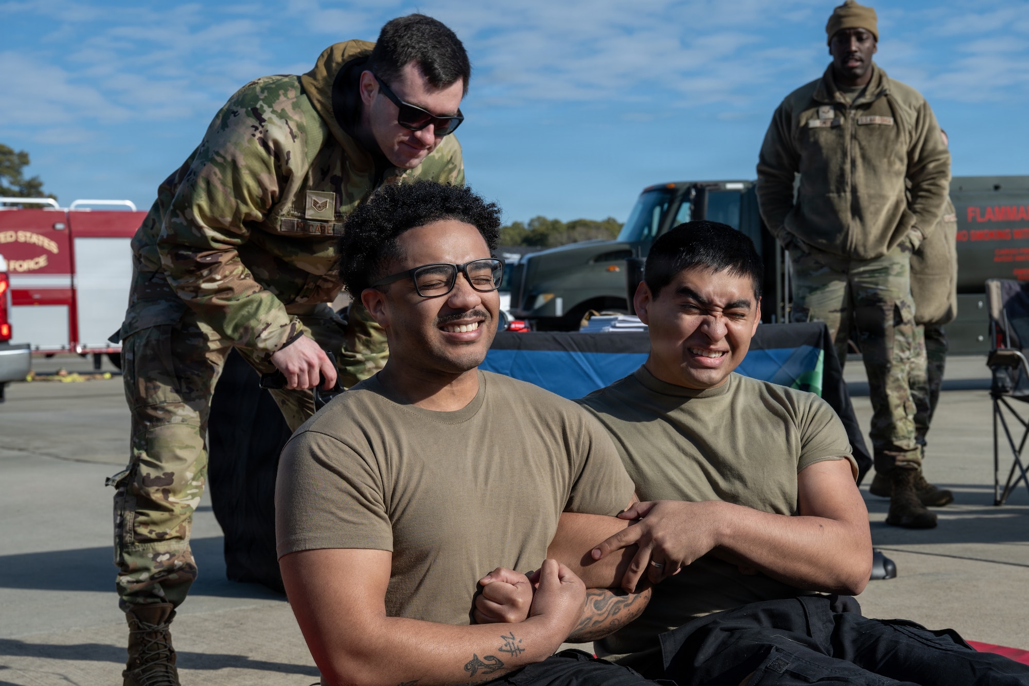 U.S. Air Force Airmen, assigned to the 4th Fighter Wing, participate in an electronic control device demonstration during an Airpower Generation Rally at Seymour Johnson Air Force Base, North Carolina, Feb. 6, 2026. Members of the 4th Security Forces Squadron conducted the demonstration to showcase the nonlethal effectiveness of a stun gun. (U.S. Air Force photo by Airman 1st Class Rebecca Tierney)