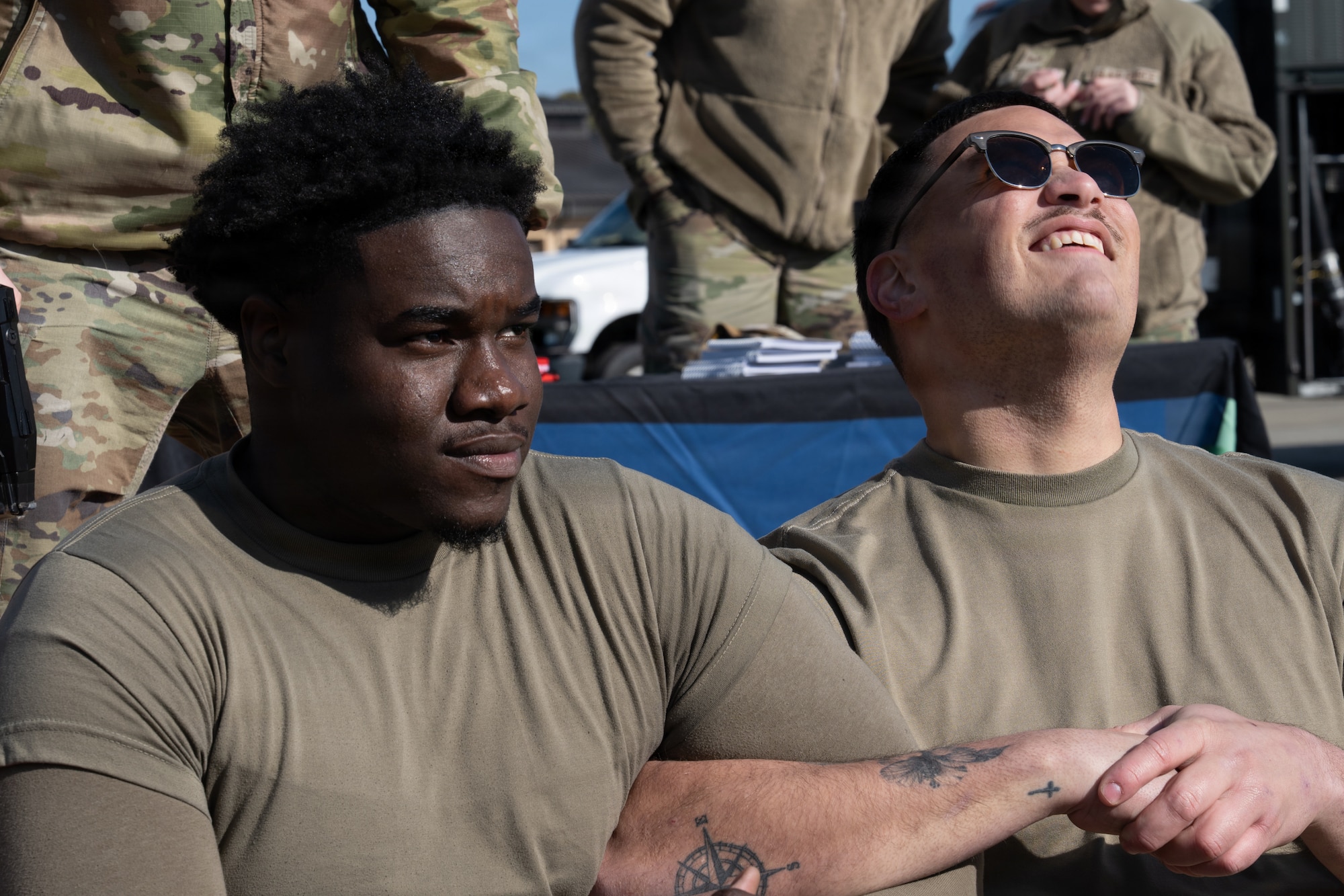 U.S. Air Force Airmen, assigned to the 4th Fighter Wing, participate in an electronic control device demonstration during an Airpower Generation Rally at Seymour Johnson Air Force Base, North Carolina, Feb. 6, 2026. Members of the 4th Security Forces Squadron conducted the demonstration to showcase the nonlethal effectiveness of a stun gun. (U.S. Air Force photo by Airman 1st Class Rebecca Tierney)
