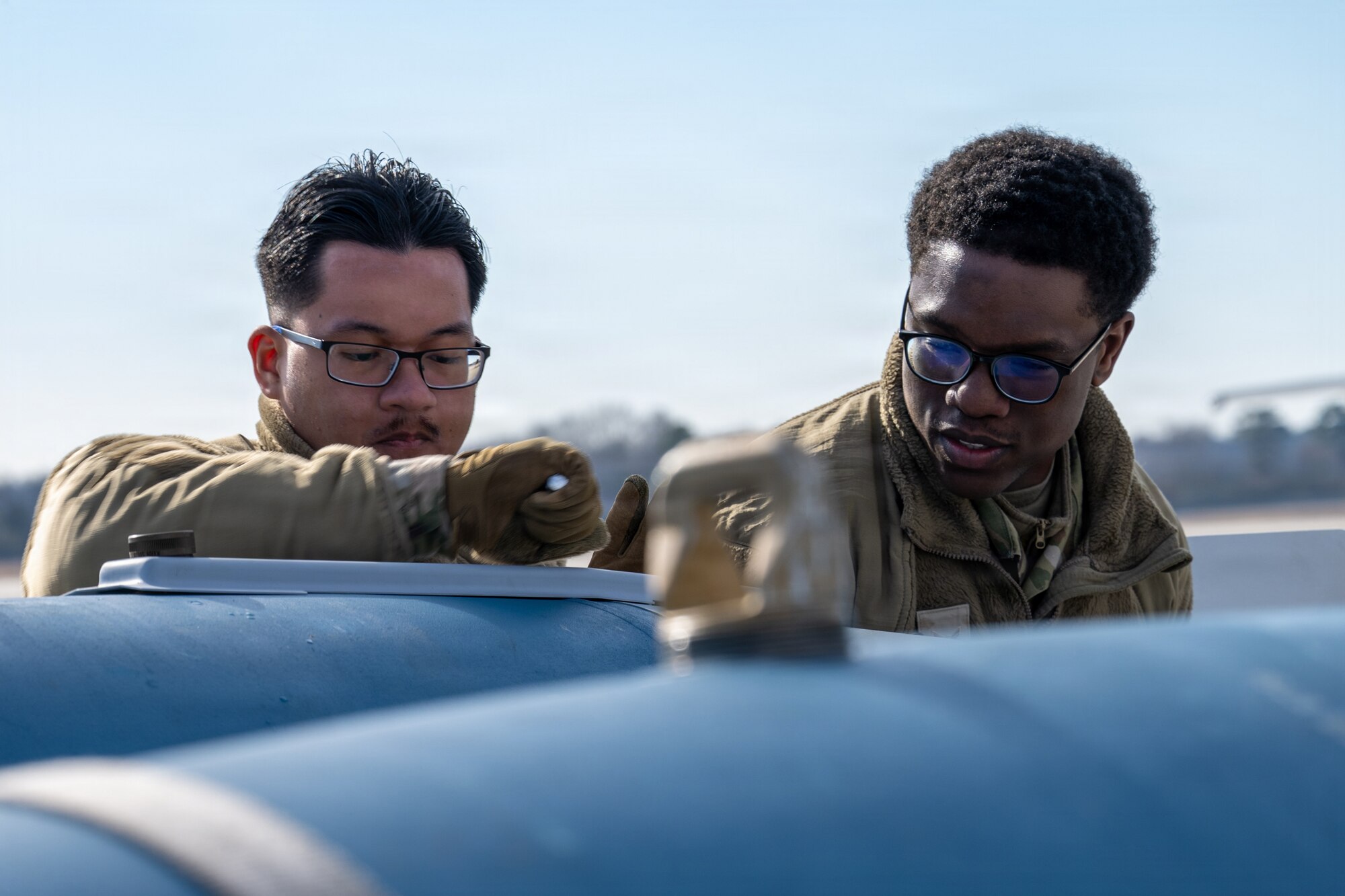 U.S. Air Force Airmen, assigned to the 4th Fighter Wing, participate in an Airpower Generation Rally at Seymour Johnson Air Force Base, Feb. 6, 2026. The event provided family members an opportunity to observe maintenance operations and understand the teamwork behind airpower generation. (U.S. Air Force photo by Airman 1st Class Rebecca Tierney)