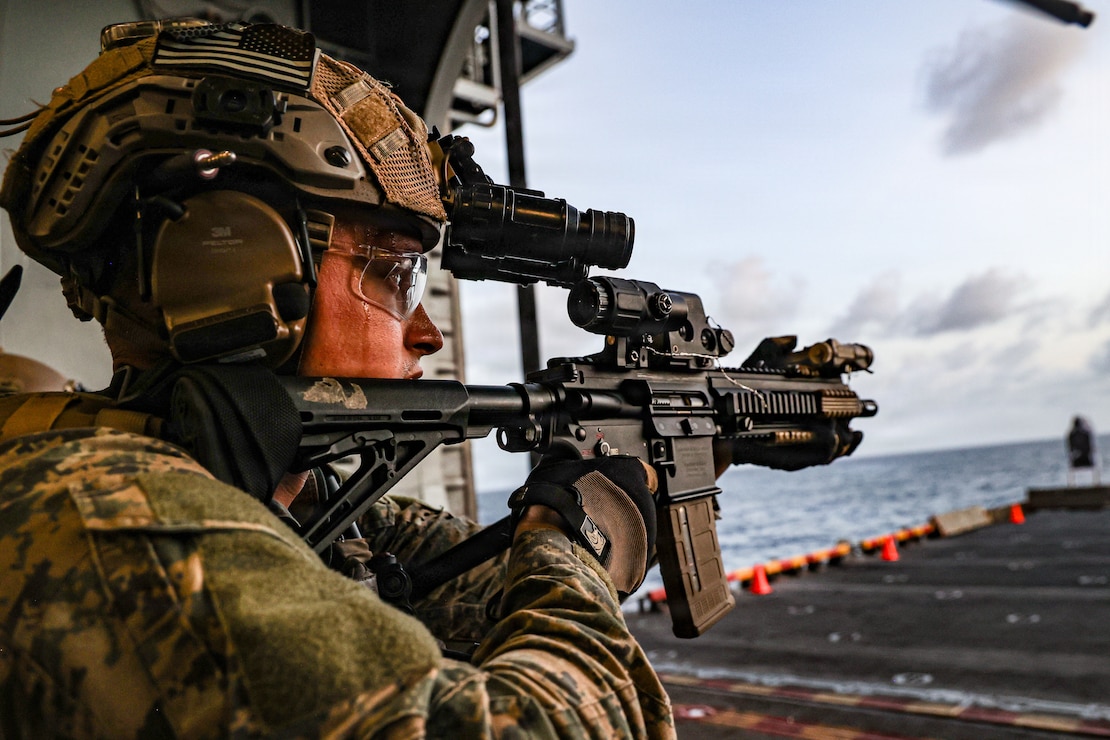 A U.S. Marine with Maritime Special Purpose Force, 22nd Marine Expeditionary Unit (Special Operations Capable) sights in on an M27 Infantry Automatic Rifle during a live-fire range aboard Wasp-class amphibious assault ship USS Iwo Jima (LHD 7), while underway in the Caribbean Sea.