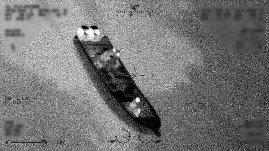 A Coast Guard HC-144 Ocean Sentry airplane crew flies over a suspected smuggling vessel off Camuy, Puerto Rico, Feb. 13 2026. Coast Guard law enforcement crews disrupted a drug trafficking go-fast vessel and seized 2,083 pounds of cocaine. (U.S. Coast Guard photo)