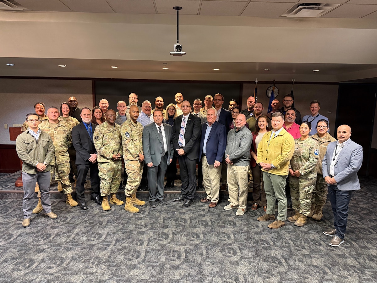 Participants of the inaugural Contested Logistics for Space Summit pose for a group photo at Peterson Space Force Base, Colo., Jan. 14, 2026. Hosted by U.S. Space Force (USSF) Space Systems Command (SSC), the first-of-its-kind summit brought together more than 50 subject matter experts from U.S. Space Command (USSPACECOM), the Department of the Air Force (DAF), Headquarters U.S. Space Force (HQ USSF), Headquarters Air Force (HAF), SSC, Space Training and Readiness Command (STARCOM), Combat Forces Command (CFC), Space Forces Space (S4S), the Defense Logistics Agency (DLA), and Air Force Materiel Command (AFMC). The event focused on aligning sustainment strategies with operational realities and fostering a warfighter culture within the logistics enterprise to ensure the USSF remains a decisive enabler of readiness and deterrence in contested environments. (U.S. Space Force photo by Jondavid DuVall)