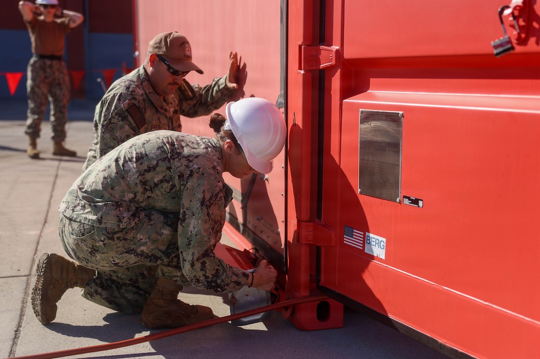 U.S. Navy Hospital Corpsman 2nd Class Ashlyn Gilmore, a general duty nursing services corpsman assigned to the hospital ship USNS Mercy (T-AH 19), center, assembles a Rapid Emplacement Medical (REM) during Exercise Steel Knight at Naval Air Station North Island in Coronado, California, Dec. 2, 2025. The Marine Corps Warfighting Laboratory/Futures Directorate examines future operating environments to generate threat-informed operating concepts and capabilities and, through experimentation, provide analytically supported recommendations to inform future force design and development activities. (U.S. Marine Corps photo by Cpl. Michael Bartman)