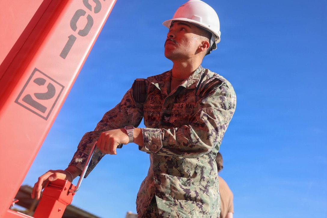 U.S. Navy Hospital Corpsman 3rd Class Anael Padilla, a preventive medicine technician assigned to the hospital ship USNS Mercy (T-AH 19), assembles a Rapid Emplacement Medical (REM) during Exercise Steel Knight at Naval Air Station North Island in Coronado, California, Dec. 2, 2025. The Marine Corps Warfighting Laboratory/Futures Directorate examines future operating environments to generate threat-informed operating concepts and capabilities and, through experimentation, provide analytically supported recommendations to inform future force design and development activities. (U.S. Marine Corps photo by Cpl. Michael Bartman)