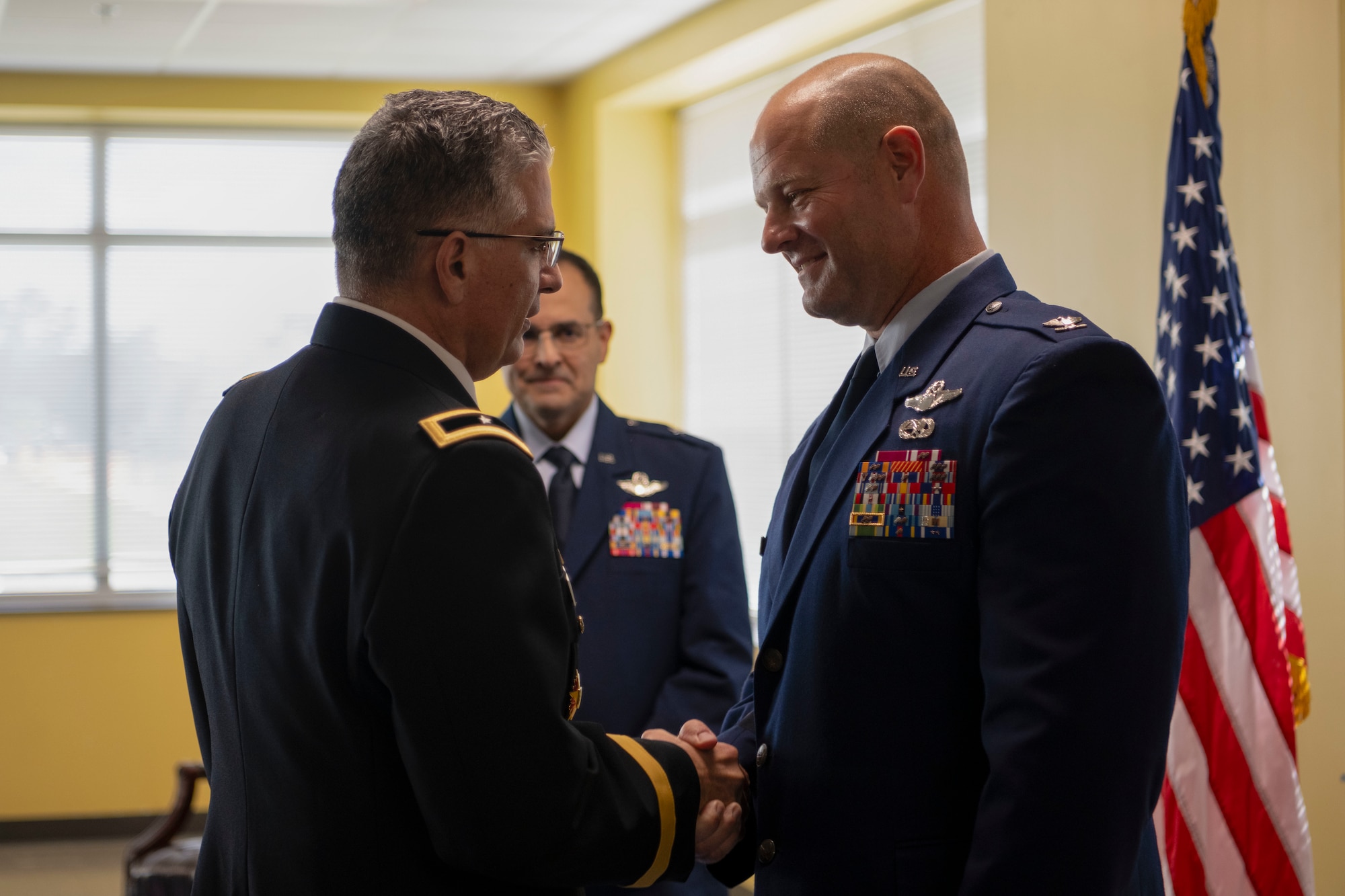U.S. Army Brig. Gen. (PR) Carlos J. Rivera Román, the adjutant general of Puerto Rico, congratulates U.S. Air Force Col. Steven L. Campbell, chief of staff, Puerto Rico Air National Guard, during Campbell’s promotion ceremony at Muñiz Air National Guard Base, Carolina, Puerto Rico, Feb. 6, 2026. During the ceremony, Campbell was recognized for his years of leadership, dedication and service. (U.S. Air National Guard photo by Senior Airman Victoria A. Jewett)
