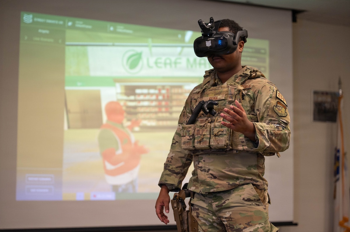 Airman wears virtual reality headset.