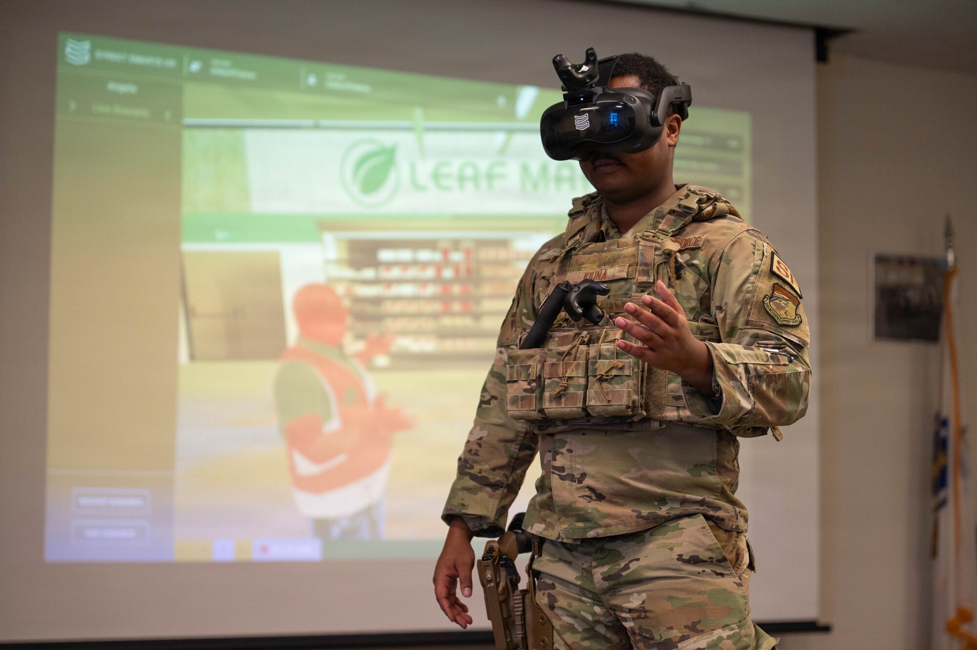 Airman wears virtual reality headset.