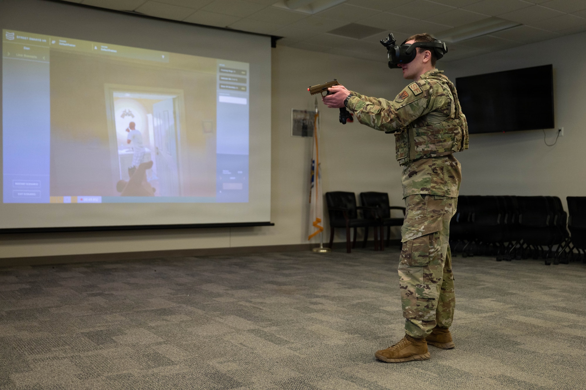 Airman wears virtual reality headset.