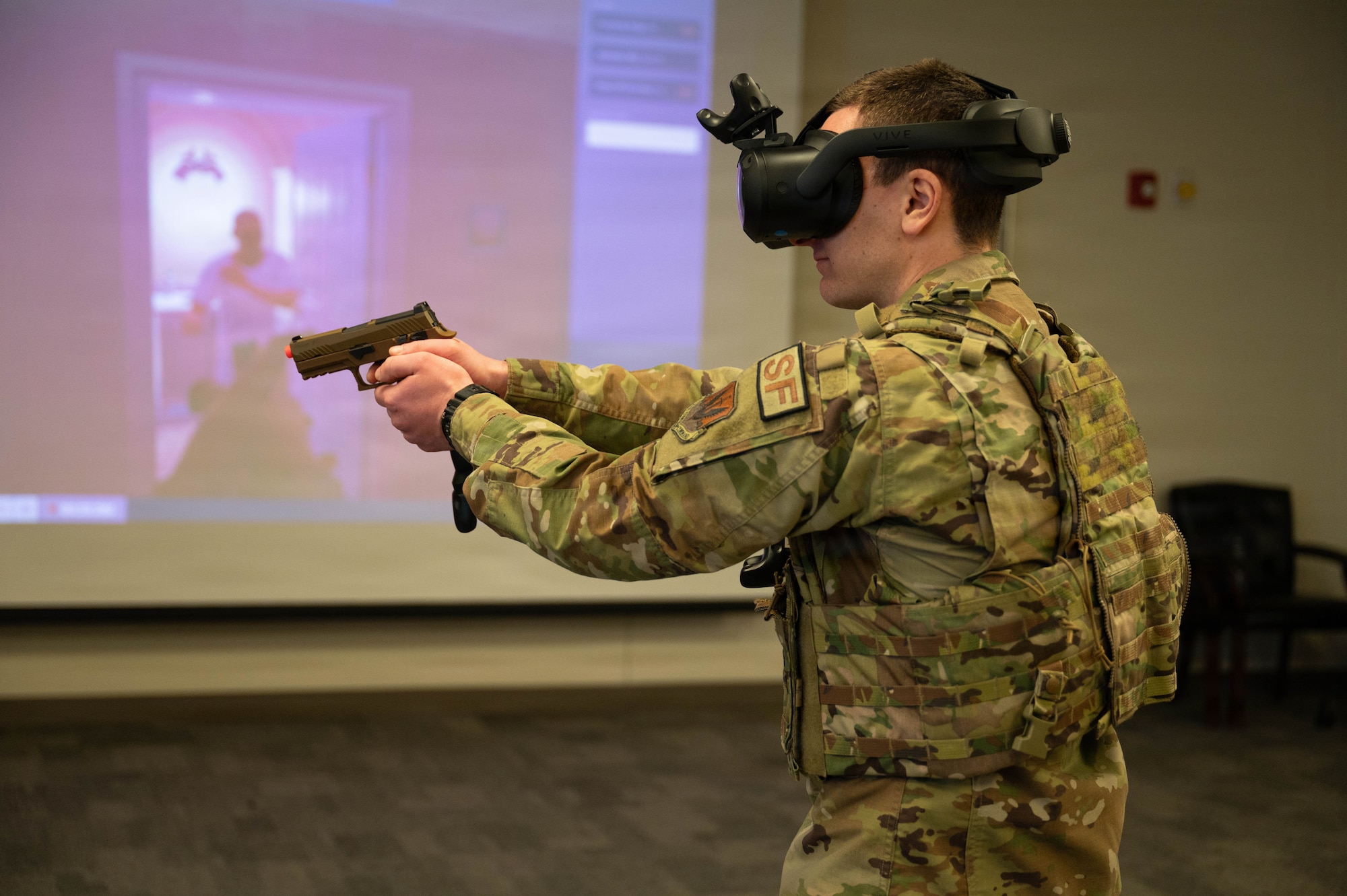Airman wears virtual reality headset.