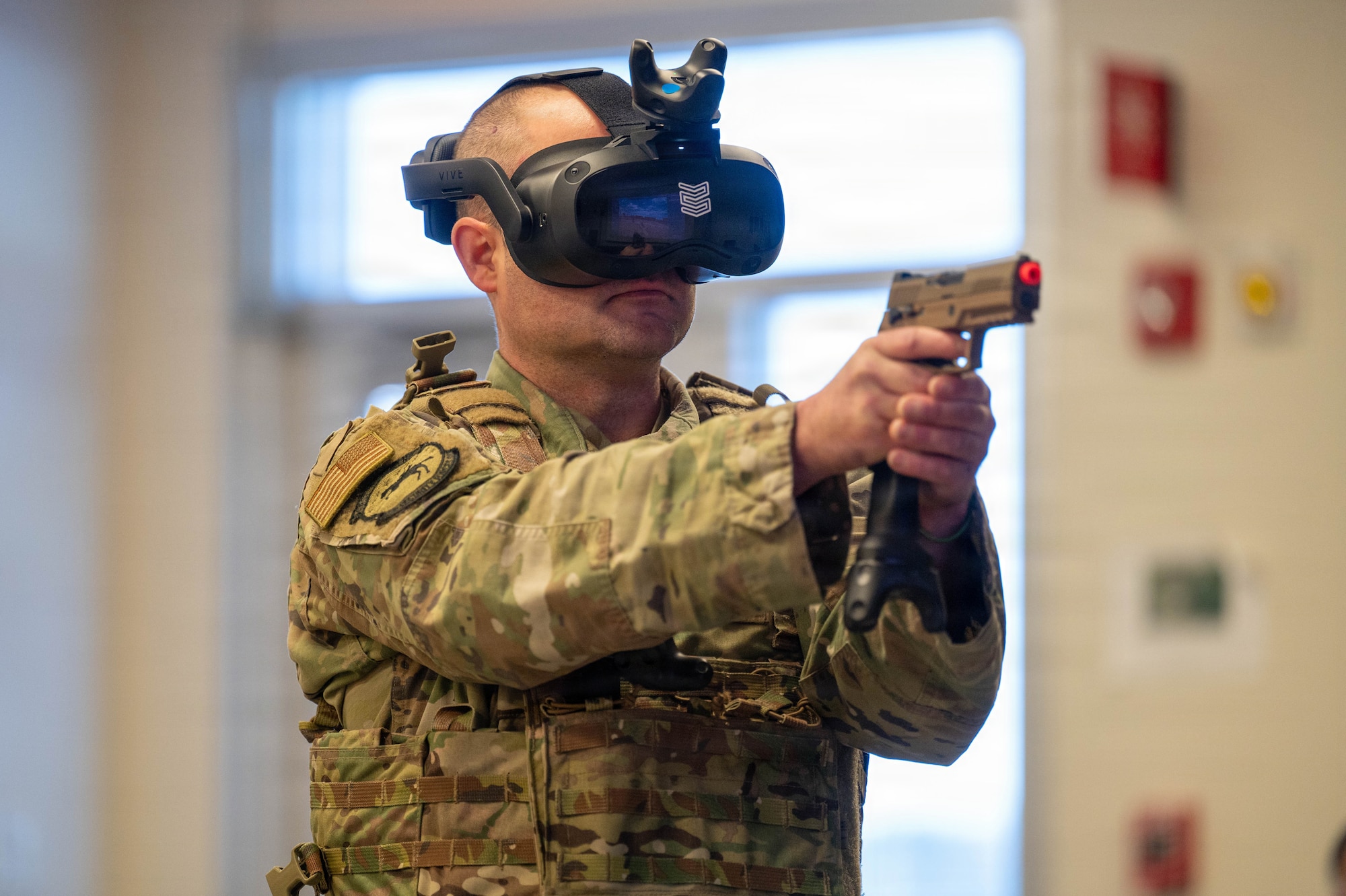 Airman wears virtual reality headset.