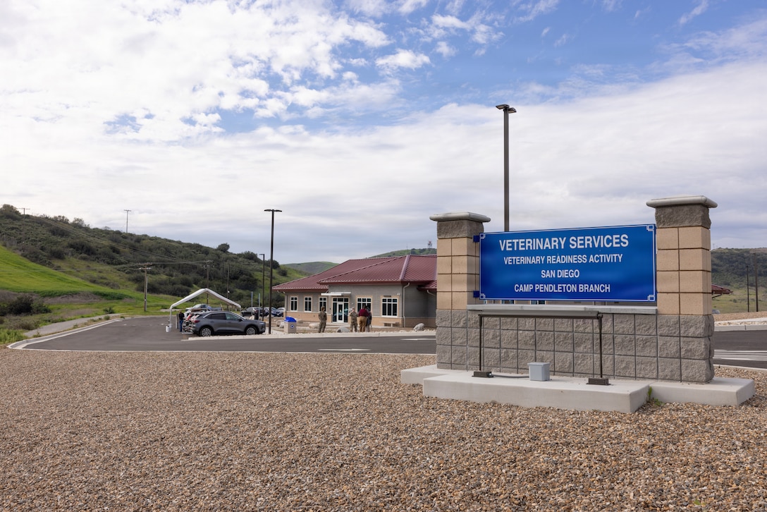 U.S. service members gather to celebrate the grand opening of the Camp Pendleton Army Veterinary Services and Veterinary Treatment Facility on Marine Corps Base Camp Pendleton, California, Jan. 22, 2026. The new state-of-the-art facility is three times larger than the previous clinic and enhances care for Military Working Dogs and privately owned animals, ensuring their health and operational readiness. (U.S. Marine Corps photo by Cpl. Paschal)