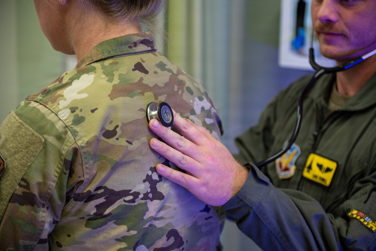 Capt. Luke Fennell, a 336th Fighter Squadron flight surgeon, listens to the heartbeat and breathing of a patient during a demonstration medical encounter at the 4th Medical Group’s Flight Medicine clinic at Seymour Johnson Air Force Base, N.C., Jan. 23, 2026. Flight Medicine personnel routinely conduct these physicals for all flight qualified Airmen to ensure their bodies can withstand the demands of flying missions. (U.S. Air Force photo by 2nd Lt. Jason Pannell).