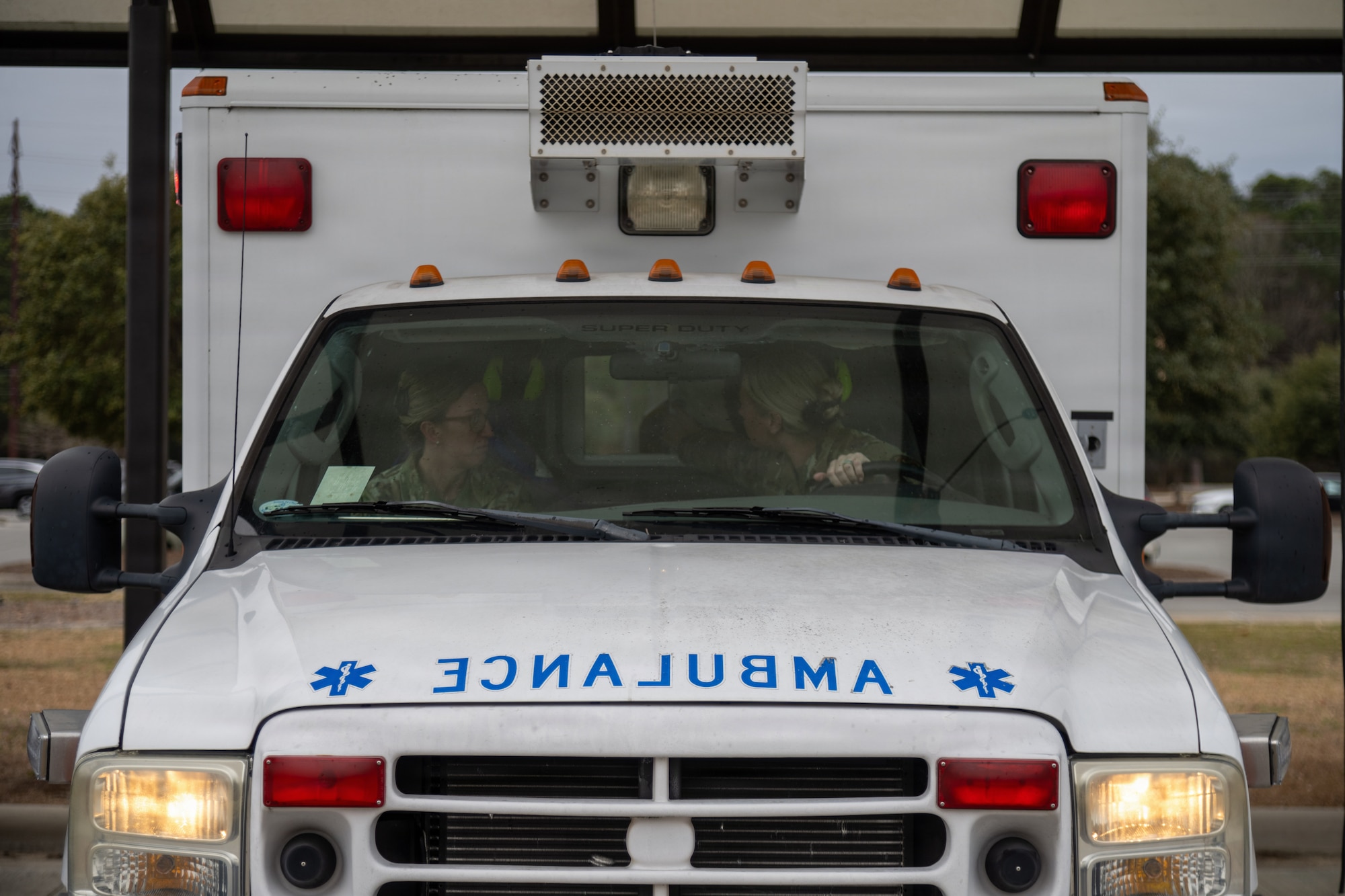 Master Sgt. Sarah Thompson, 4th Medical Group Flight Medicine flight chief, and Staff Sgt. Anicia Roberson, 4th Medical Group medical technician, demonstrates ambulance flight line response to an in-flight emergency or ground emergency outside of the 4th Medical Group at Seymour Johnson Air Force Base, N.C. Jan. 23, 2026. Flight Medicine personnel at the 4th Medical Group train to respond to flight line emergencies within five minutes of notification for trusted and speedy care. (U.S. Air Force photo by 2nd Lt. Jason Pannell).