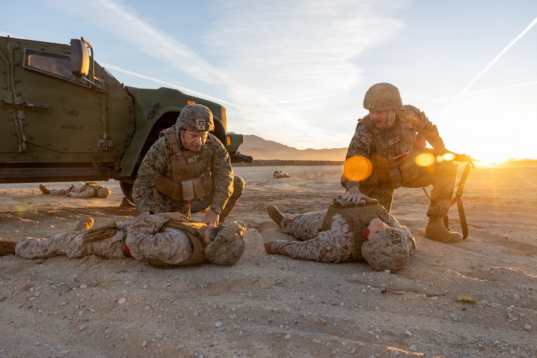 U.S. Navy Lt. Billy R. Wickham, left, a chaplain, California native with Headquarters and Support Battalion, 1st Marine Logistics Group, and U.S. Navy Petty Officer 2nd Class Nicholas D. Cluck, right, a religious program specialist with Headquarters Battalion, 1st Marine Logistics Group, execute a mass casualty response simulation during Integrated Training Exercise 1-26 at Camp Wilson, Marine Corps Air Ground Combat Center, Twentynine Palms, California, Jan. 15, 2026. ITX enables units to mobilize geographically dispersed forces for potential future deployments, increases combat readiness and lethality, and exercises Marine Air-Ground Task Force command and control of battalions and squadrons across the full spectrum of warfare. (U.S. Marine Corps photo by Lance Cpl. Jozef P. Majewski)