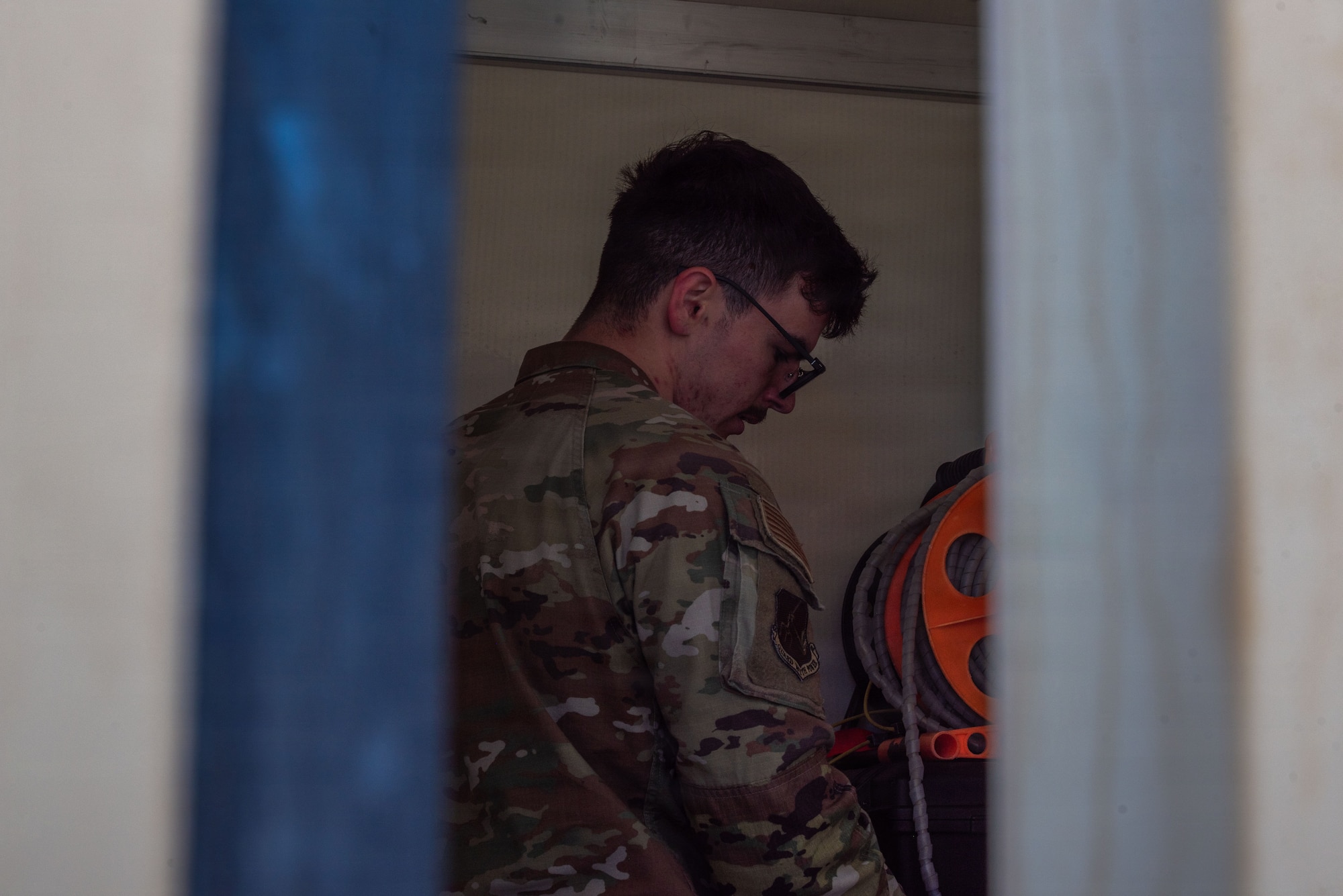 U.S. Air Force Kegan McCartney, 25th Aircraft Maintenance Squadron crew chief, unloads an Internal Airlift/Helicopter Slingable Container Unit in preparation for exercise Bamboo Eagle 26-1 at Point Mugu Naval Air Station, Calif., Feb. 12, 2026.