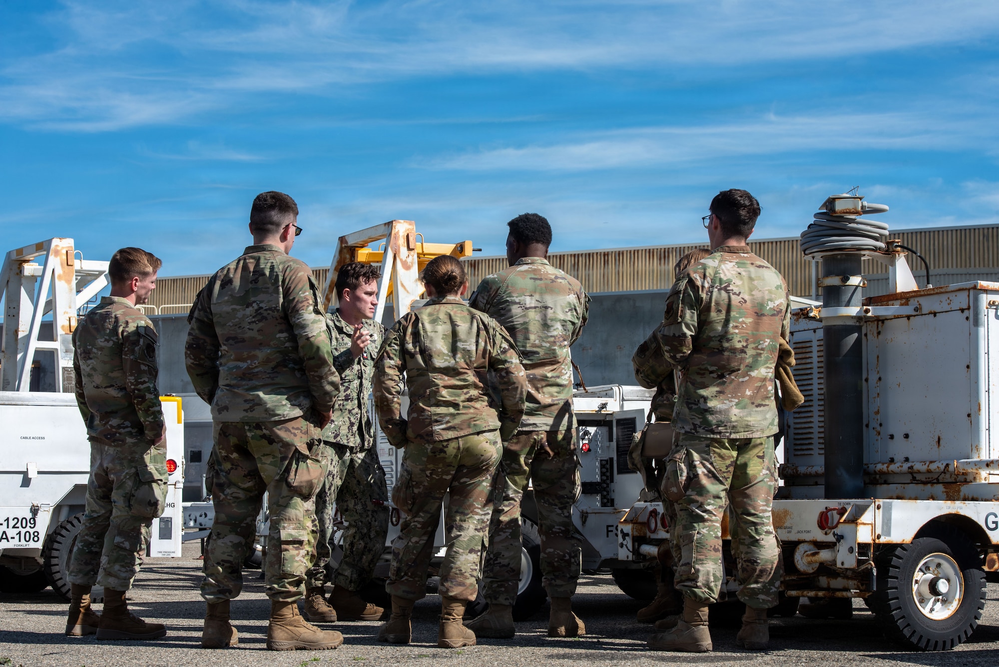 U.S. Navy Petty Officer 2nd Class Sabahudin Covic, 900 Division floor supervisor, trains Airmen assigned to the 25th Aircraft Maintenance Squadron to operate U.S. Navy NC-10C Mobile Electric Power Plants during exercise Bamboo Eagle 26-1 at Point Mugu Naval Air Station, Calif., Feb. 12, 2026.