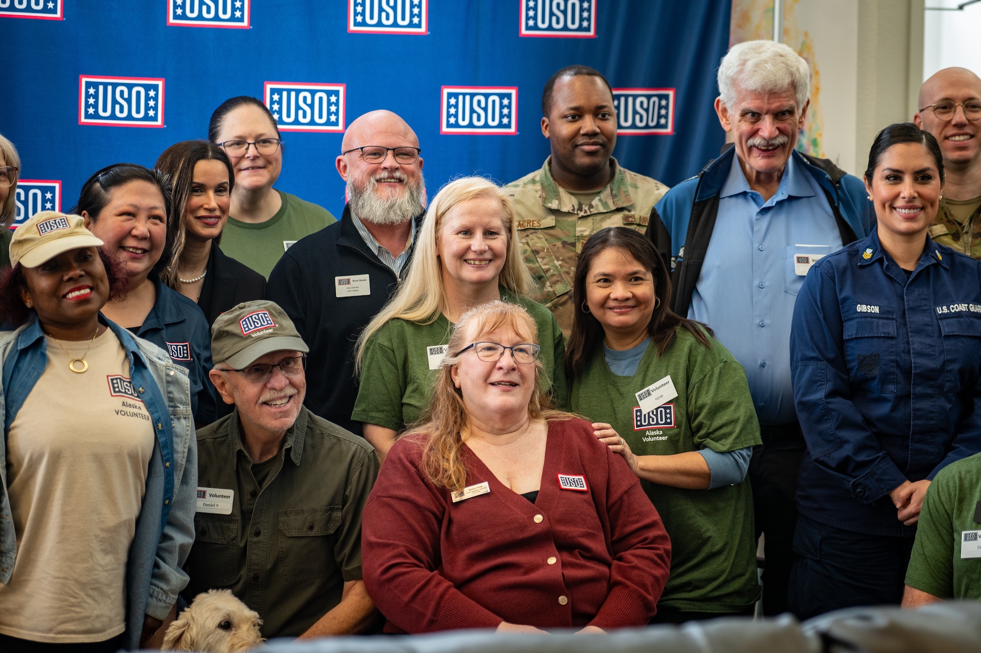 USO volunteers pose for a photo during an event at the Elmendorf USO at Joint Base Elmendorf-Richardson, Alaska, Feb. 11, 2026. The event highlighted a decade of USO support to service members and their families stationed at JBER. (U.S. Air Force photo by Senior Airman Hunter Hites)