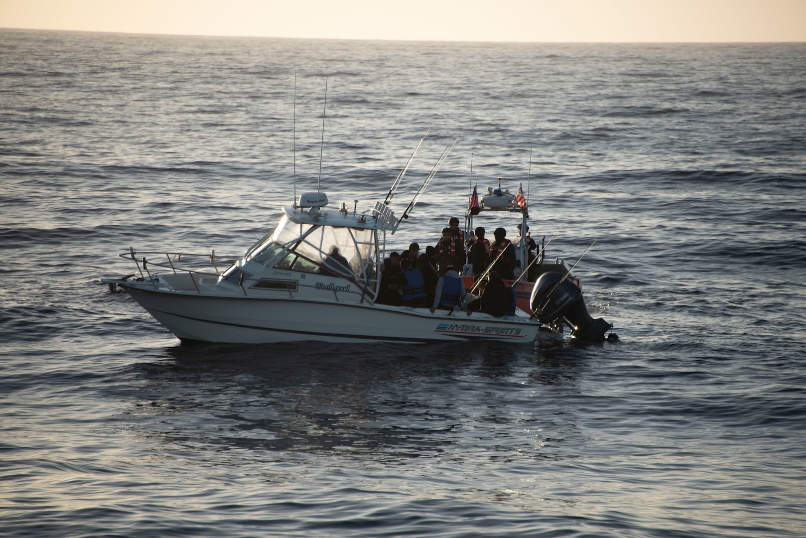 A vessel with suspected illegal migrants is boarded by the Coast Guard.