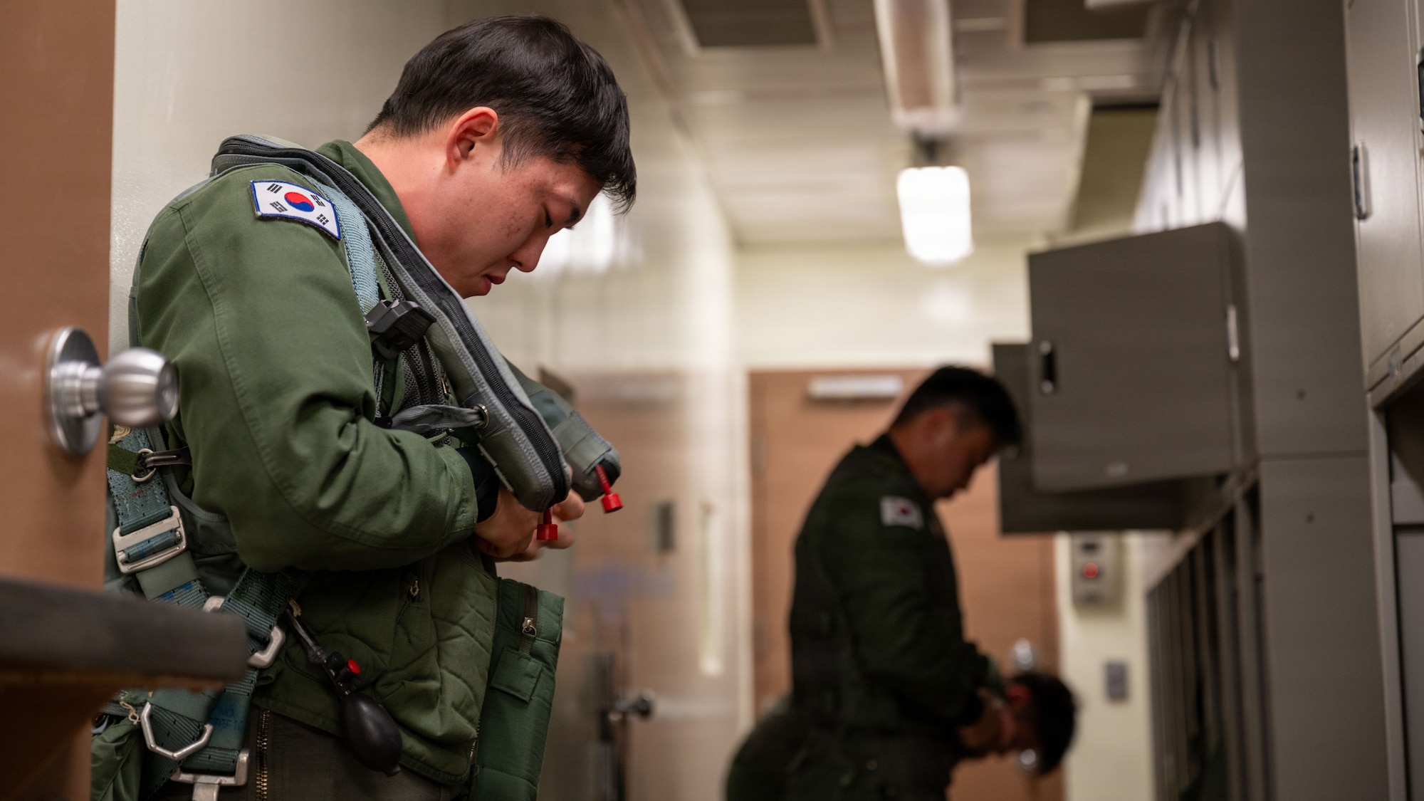 Republic of Korea Air Force KF-16 pilots assigned to the 111th Fighter Squadron, prepare to fly during Buddy Squadron 26-2 at Osan Air Base, ROK, Feb. 12, 2026. The recurring training event strengthens alliance partnerships and ensures both forces remain ready to defend the peninsula and execute the Fight Tonight mission. (U.S. Air Force photo by Senior Airman Rome Bowermaster)