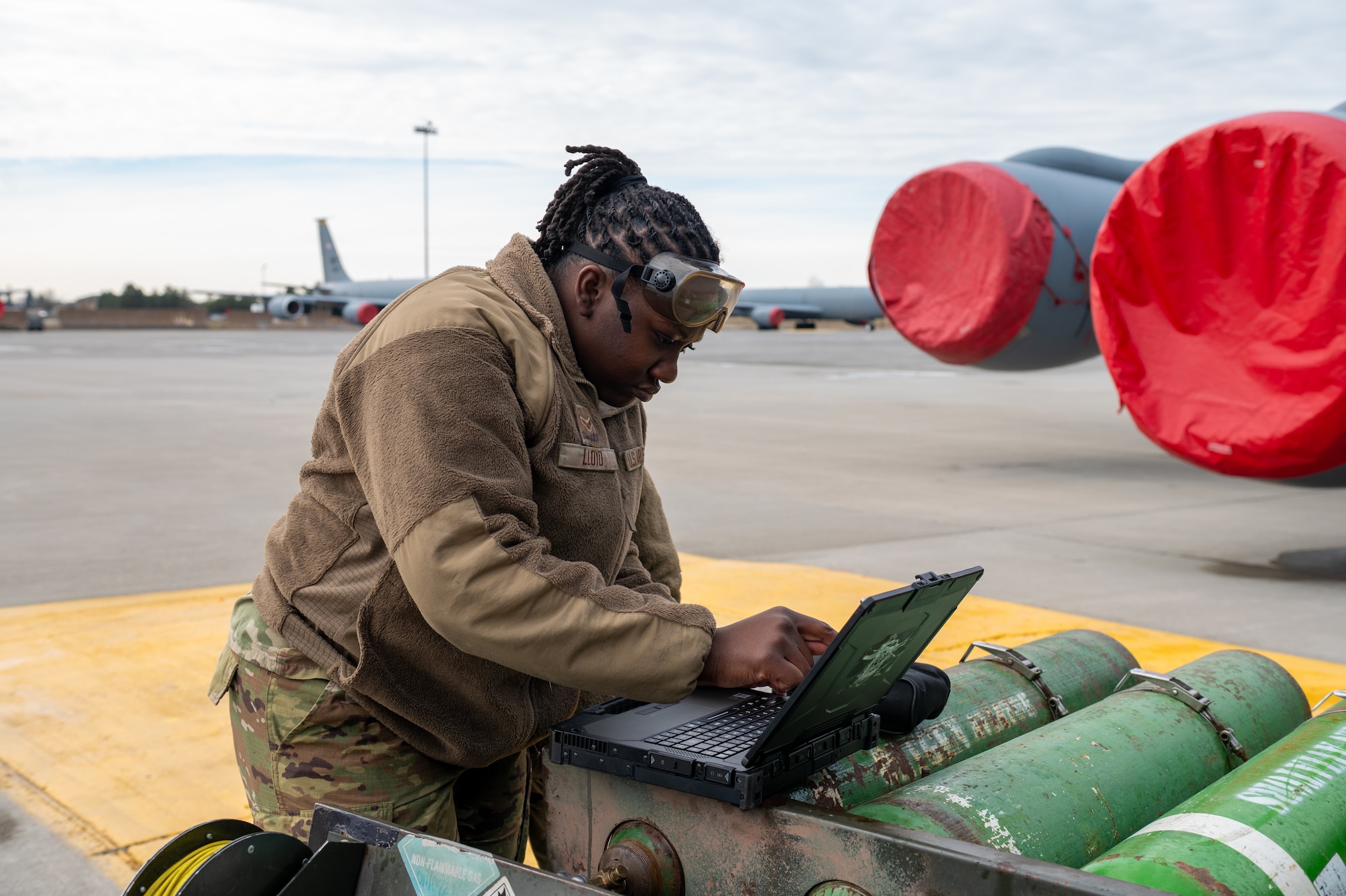 A military member fills out a form.