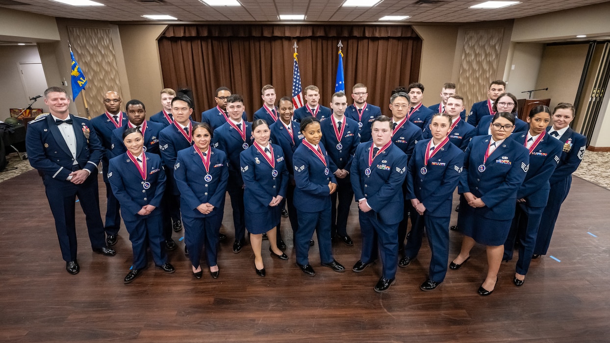 A large group photo of men and women in formal Air Force dress uniforms
