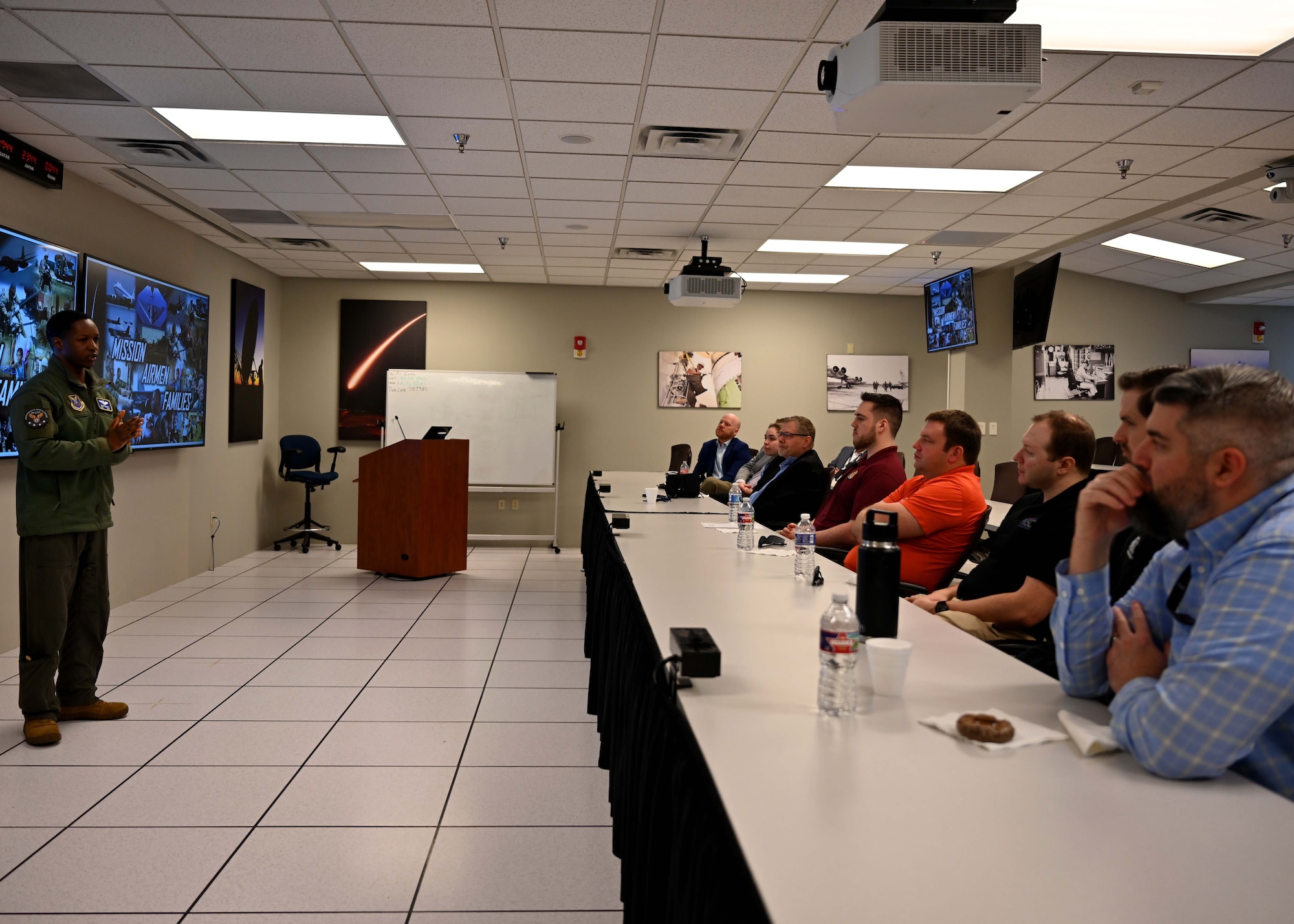 A briefer speaks to personnel