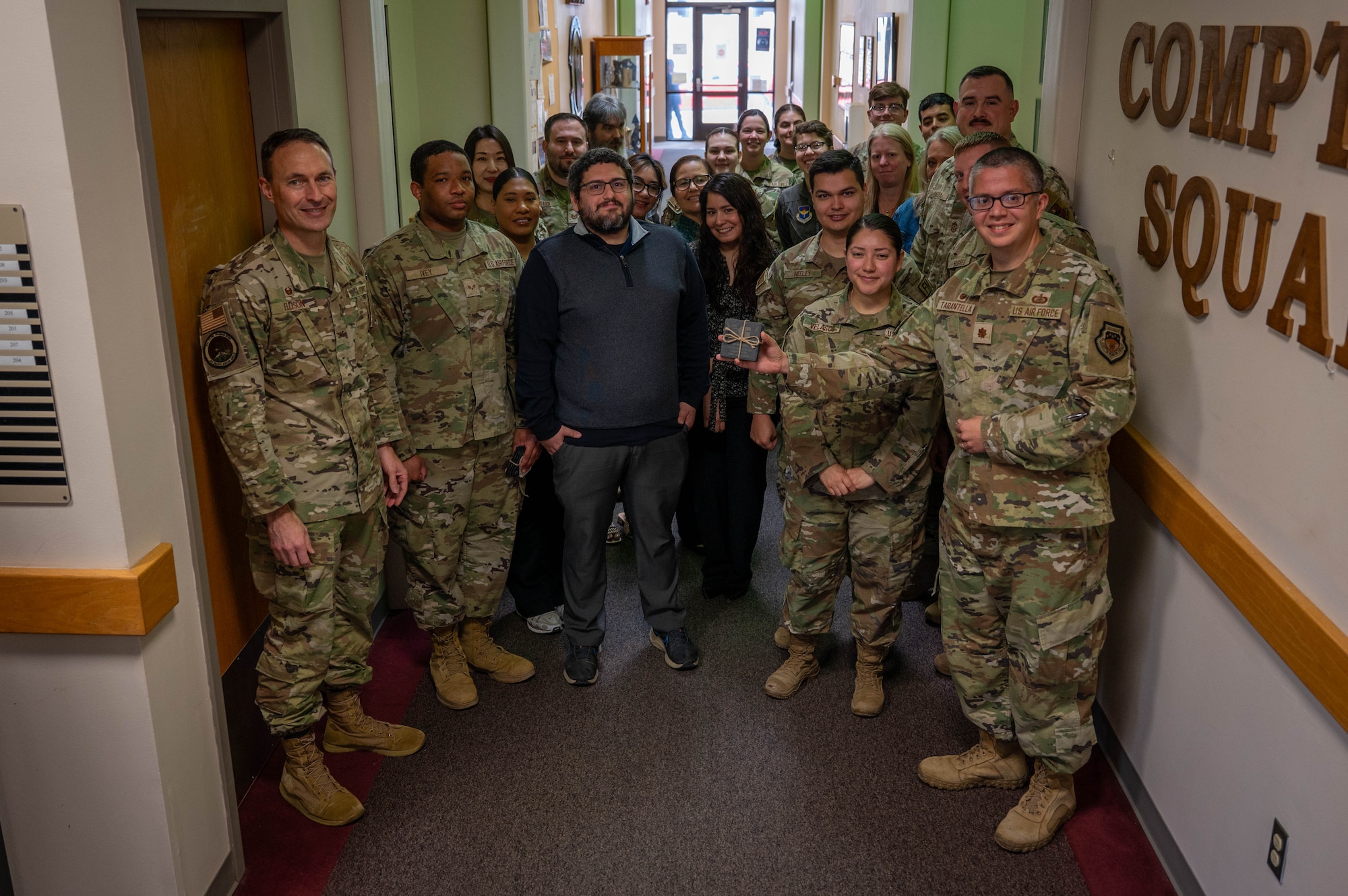 The 47th Comptroller Squadron pose for a photo for being awarded as the team of the fourth quarter.