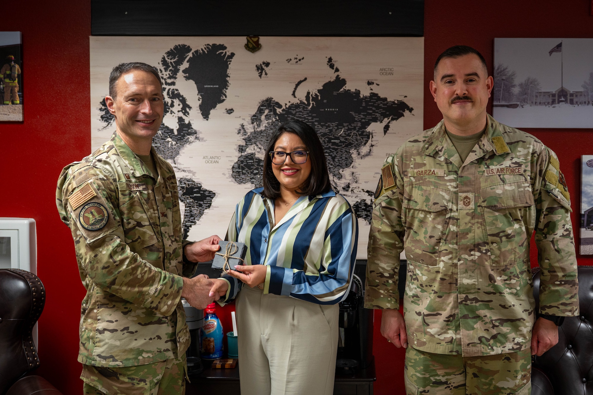 An civilian is presented an award as the category II non-supervisory civilian of the quarter of the fourth quarter.