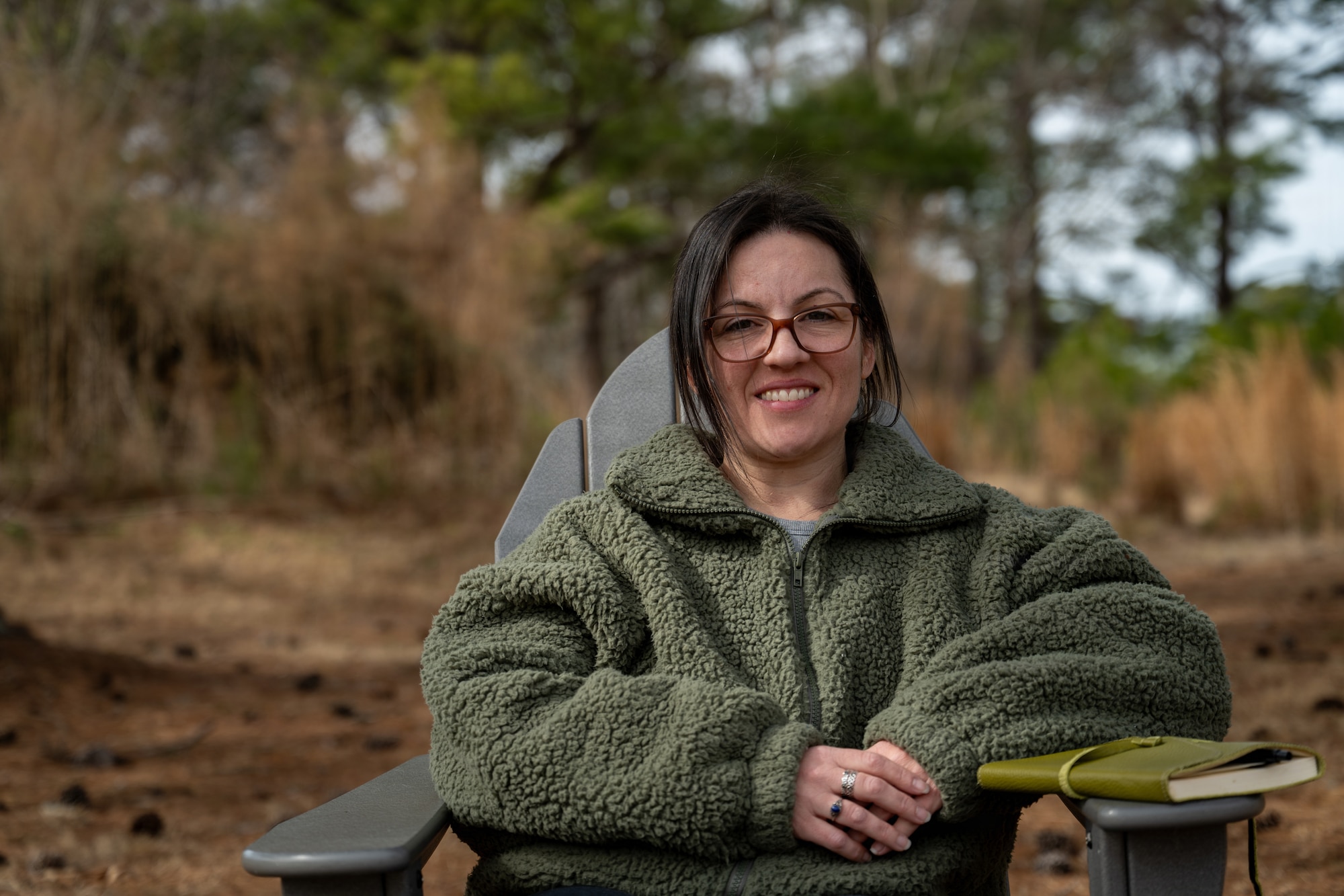 U.S. Air Force Staff Sgt. Alison Gandulla, 4th Contracting Squadron contract specialist, poses for an environmental portrait at Seymour Johnson Air Force Base, North Carolina, Feb. 12, 2026. Gandulla uses personal experiences to create poetry that cultivates resilience and mental fortitude. (U.S. Air Force photo by Airman 1st Class Rebecca Tierney)