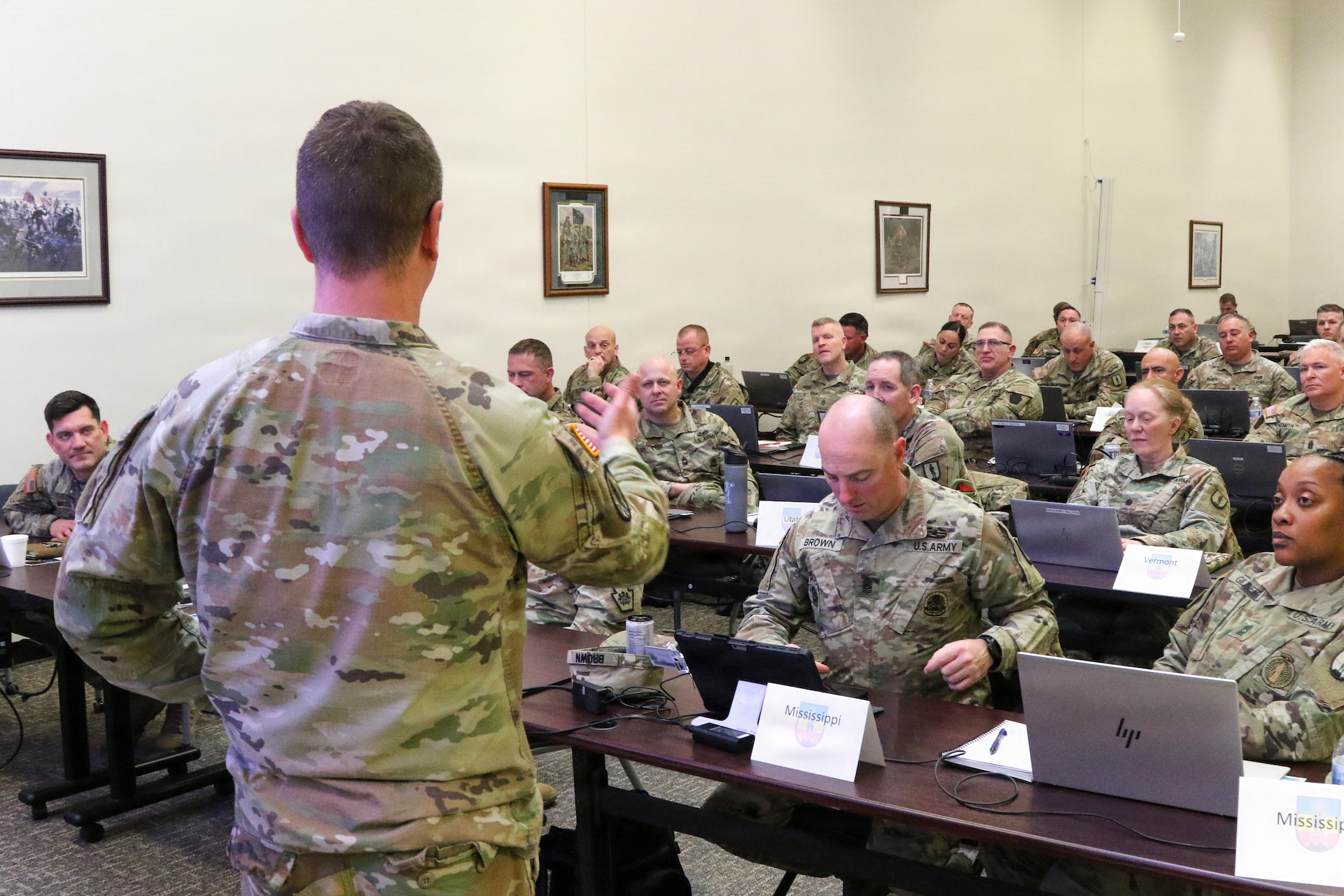 U.S. Army 1st Sgt. Matthew Schreckengost, U.S. Army NCO Academy subject matter expert, briefs attendees during a National Guard NCO education conference at Fort Indiantown Gap, Pennsylvania Feb. 18, 2026. Representatives from the National Guard Bureau, the U.S. Army NCO Academy and 14 Regional Training Institutes nationwide convened to plan and synchronize in preparation for changes to NCO professional military education coming later this year. (U.S. Army National Guard photo by Sgt. 1st Class Shane Smith)