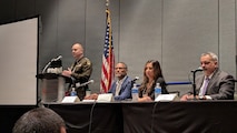 U.S. Indo-Pacific Command’s J708 Pacific Multi Domain Training and Experimentation Capability Program Manager, Dr. Andre Stridiron III (seated, left), stresses the importance of integrating training capabilities in space, cyber, and the electromagnetic spectrum, as a panelist at the 2025 Interservice/Industry Training, Simulation and Education Conference, December 4, in Orlando, Florida.