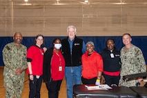 A photo of American Red Cross team members and visitors standing together.