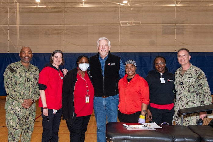 A photo of American Red Cross team members and visitors standing together.