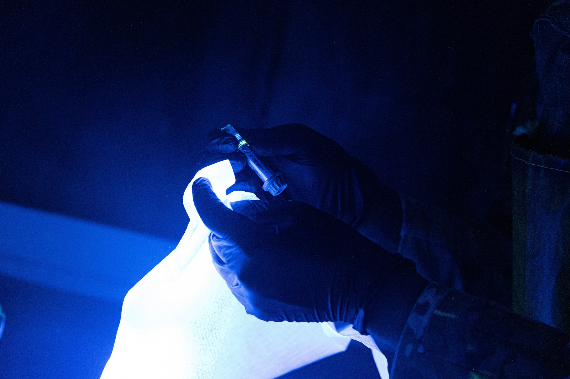 U.S. Air Force Airman Kobe Parquette, 56th Equipment Maintenance Squadron non-destructive inspection apprentice, uses UV lights to clean F-16 Fighting Falcon bolts, Feb. 17, 2026, at Luke Air Force Base, Arizona.