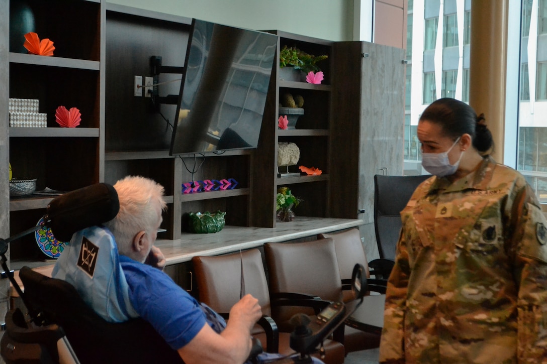 A U.S. Army Soldier assigned to the Defense Logistics Agency Troop Support listens to a U.S. military veteran at the Corporal Michael J. Crescenz Department of Veterans Affairs Medical Center in Philadelphia, Pennsylvania, Feb. 11, 2026. The Soldier was part of a delegation visiting the hospital during National Salute to Veteran Patients Week to connect with and honor the service of military veterans.