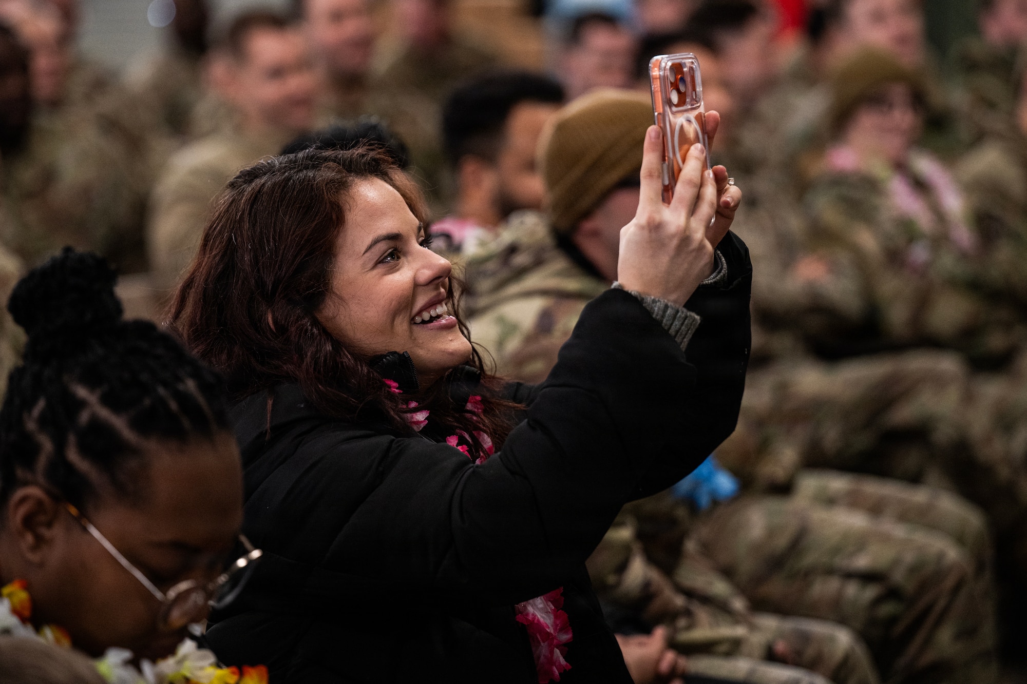 Woman takes photo.