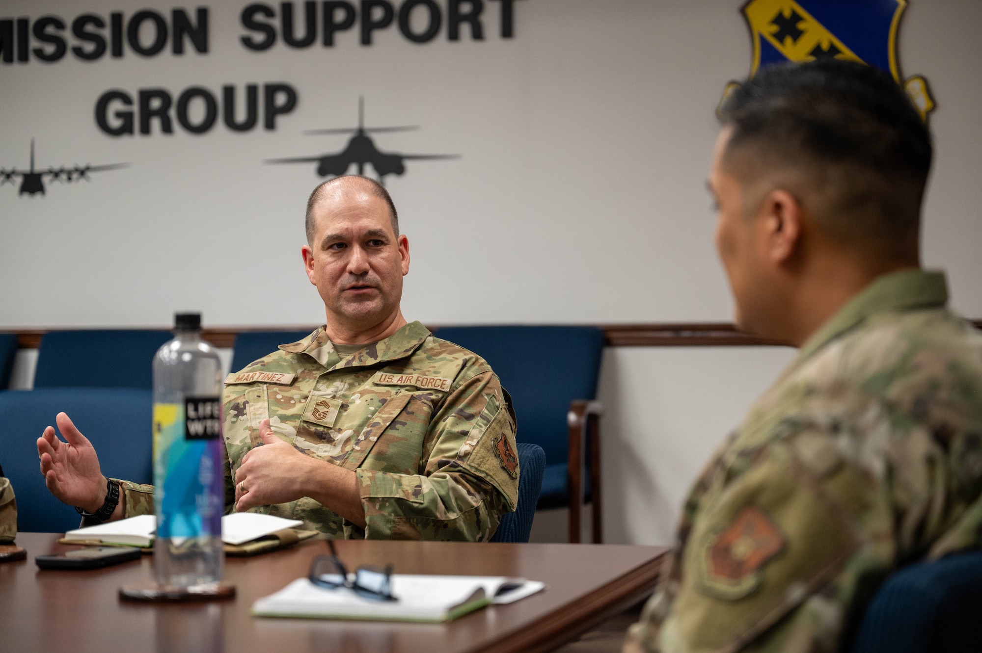 U.S. Air Force Chief Master Sgt. Richard Martinez, Army and Air Force Exchange Service senior enlisted advisor, speaks with Col. Gregory Savella, 7th Mission Support Group commander, at Dyess Air Force Base, Texas, Feb. 10, 2026. The visit included discussions on Exchange operations and future service improvements for the installation community. (U.S. Air Force photo by Airman 1st Class William Neal)