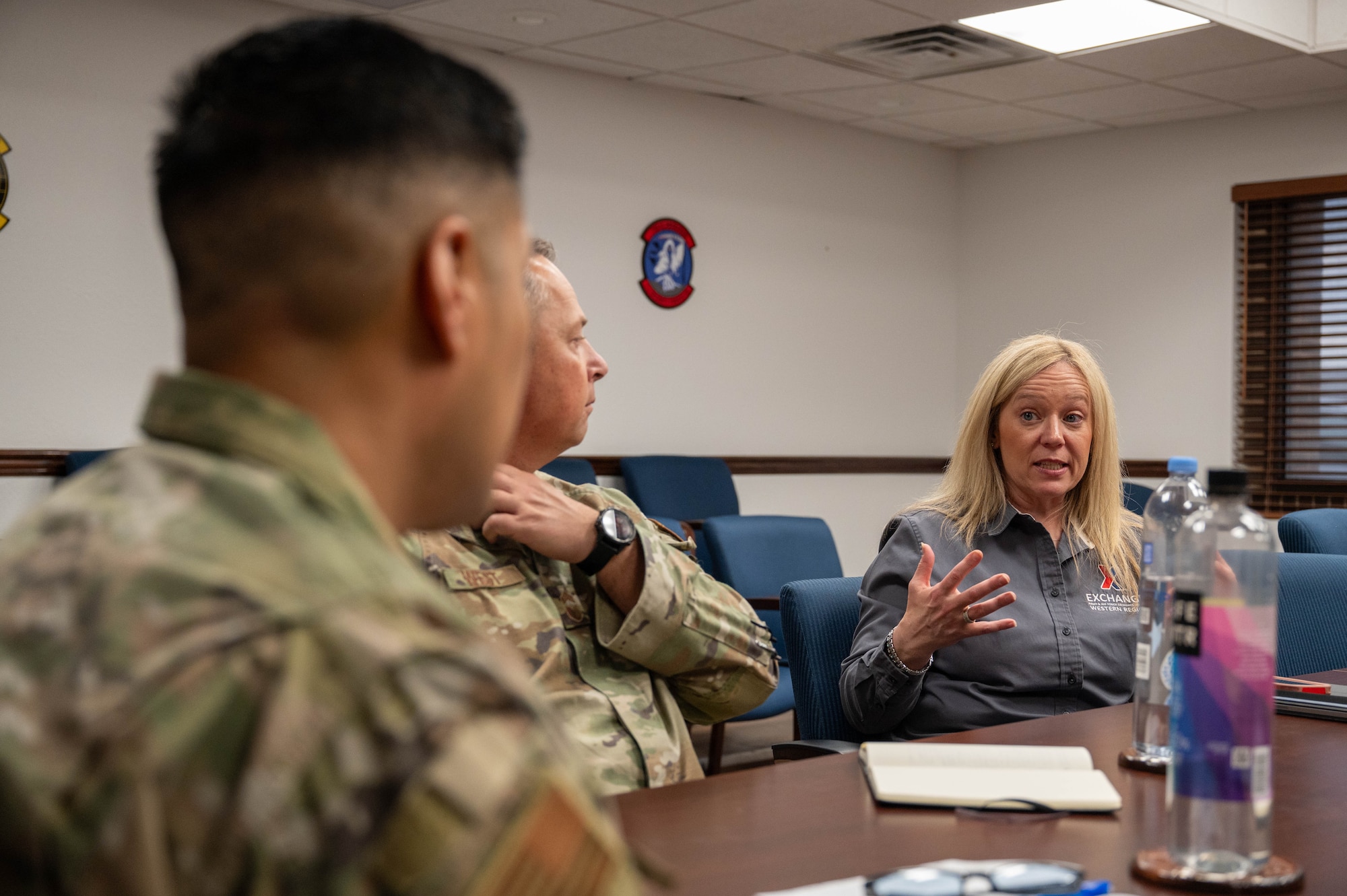 Christine Harlan, Army and Air Force Exchange Service Southwest region vice president, meets with Col. Gregory Savella, 7th Mission Support Group commander, and Chief Master Sgt. Bradley West, 7th MSG senior enlisted leader, at Dyess Air Force Base, Texas, Feb. 10, 2026.  The discussion focused on Exchange operations and identifying ways to improve customer service and quality-of-life programs. (U.S. Air Force photo by Airman 1st Class William Neal)