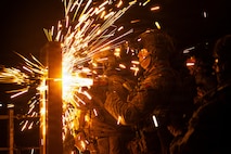 U.S. Marines with Maritime Raid Force, 31st Marine Expeditionary Unit, breach a simulated point of entry during a visit, board, search and seizure (VBSS) operation aboard the landing dock transport ship, USS San Diego (LPD 22) in the Philippine Sea, Feb. 6, 2026