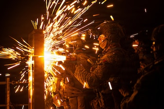 U.S. Marines with Maritime Raid Force, 31st Marine Expeditionary Unit, breach a simulated point of entry during a visit, board, search and seizure (VBSS) operation aboard the landing dock transport ship, USS San Diego (LPD 22) in the Philippine Sea, Feb. 6, 2026